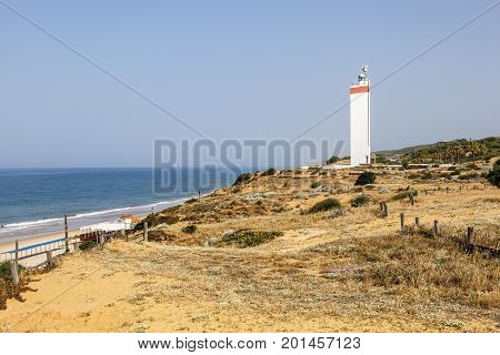 Lighthouse at the atlantic ocean coast near town Matalascanas in Andalusia Spain