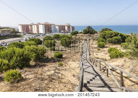 Wooden walkway at a sand dune at the atlantic coast in Matalascanas. Costa de la Luz Andalusia Spain