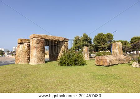 Matalascanas Spain - June 2 2017: Stone henge replika in the roundabout of town Matalascanas Andalusia Spain