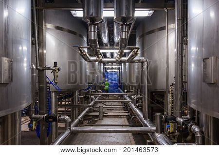 Stainless steel mixing tank on production line in pharmacy and beverage industry manufacture factory
