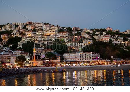 ULCINJ, MONTENEGRO - JULY 28, 2017: Night view of Ulcinj, Montenegro. Small beach - Mala Plaza at night time.
