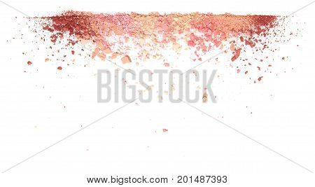 Samples of dry blush, powder, bronzers and highlighter scattered in line isolated on white background