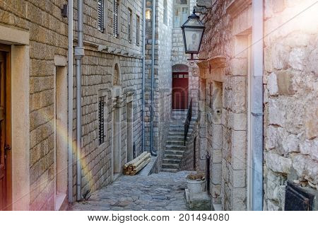 Old narrow street in Stari Grad of Ulcinj Montenegro. The fortress in the Old town in a sunny summer day.