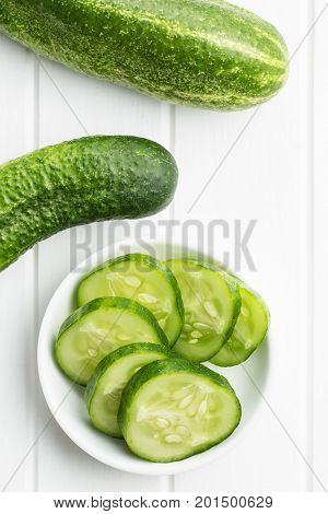 Sliced green cucumbers. Cucumbers in bowl. Top view.