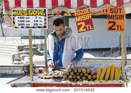 ISTANBUL, TURKEY - 1 APRIL , 2017:Sellers of fried corn chestnuts in the streets of Istanbul in Turkey