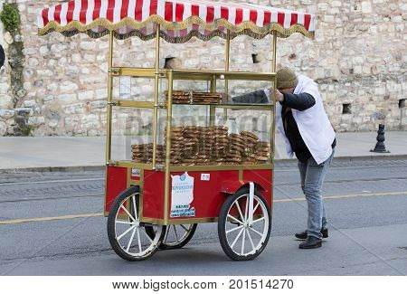ISTANBUL, TURKEY - 1 APRIL , 2017:Street sales of traditional Turkish bagels Simit, are on the streets of Istanbul in Turkey