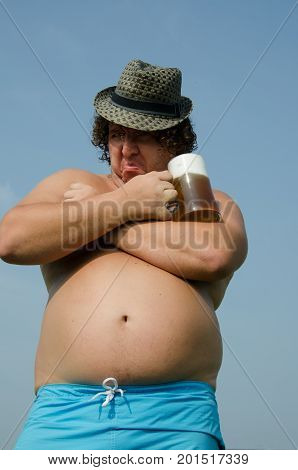 Party. Drunk man with a beer. Funny fat guy.
