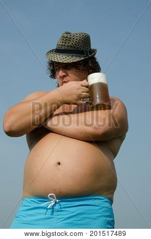Party. Drunk man with a beer. Funny fat guy.