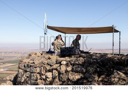 Golan Heights Israel August 27 2017 : The peacekeeper from the UN forces looks toward Syria being on a fortified point on Mount Bental on the Golan Heights in Israel.