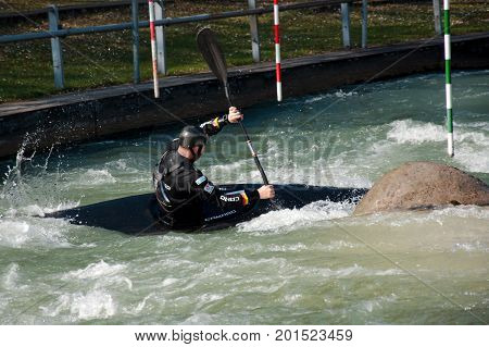 AUGSBURG, GERMANY - MARCH 28, 2017: Kayac slalom training to qualify for the Whitewater National Championships in Ottawa Canada 2017 using the course for the Summer Olympic Games in Germany in 1972.