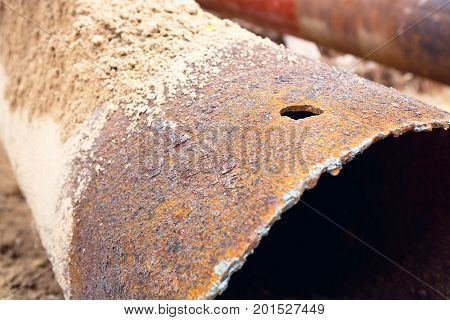 Fragments Of Old Large Water Pipes. After Many Years Of Operation, Corroded Metal Pipe Destroyed. Ru
