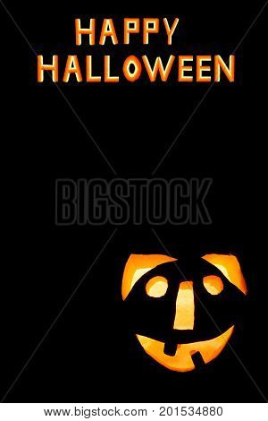 HappyHalloween pumpkin with scary face on black backgound