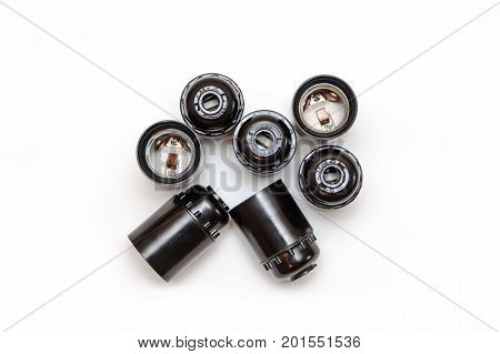 Set of plastic and ceramic electric cartriges for bulb isolated on white. Top view.