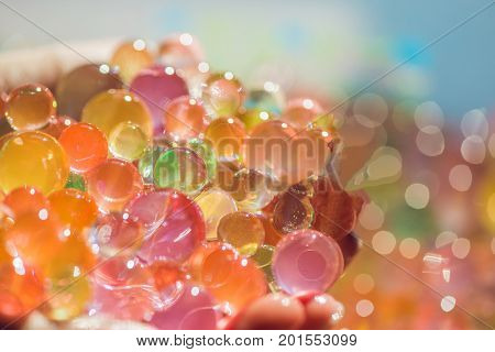 Colored Balls Of Water Beads, Hydrogel In In Hands. Sensory Experiences