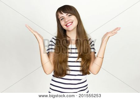 Joyful. Very happy woman On a gray background.