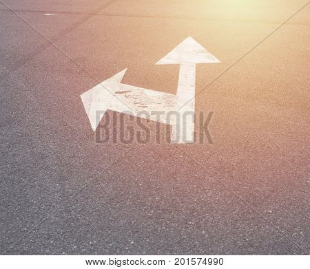 Left And Forward Arrow On The Streer With Sunrise Light