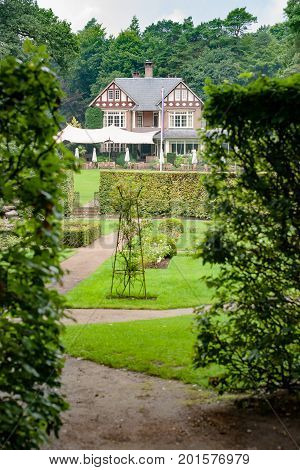Great atmospheric outside house in the woods that is used as a hotel and retaurant