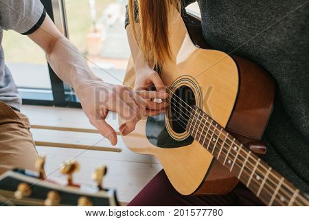Learning to play the guitar. Music education and extracurricular lessons. Guitarist