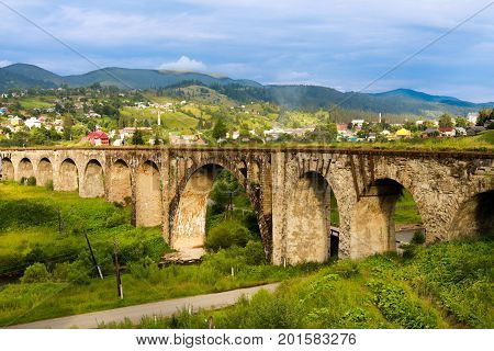 Old railway bridge, old viaduct Vorohta, Ukraine. Carpathian Mountains, wild mountain landscape