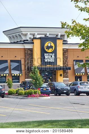 PLATTSBURGH USA - AUGUST 23 2017 : Buffalo Wild Wings restaurant and logo. Buffalo Wild Wings is an American casual dining restaurant and sports bar franchise