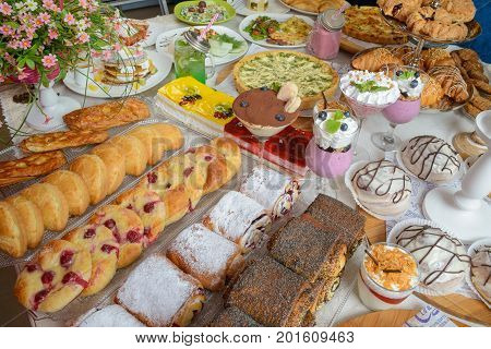 Table full of assorted confectionery sweets and desserts
