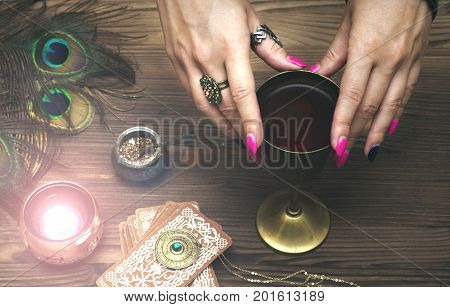 Tarot cards on fortune teller table. Divination. Witchcraft. Witch prepares a magic potion.