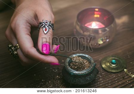 Witch prepares a magic potion. Fortune teller table. Divination. Witchcraft.