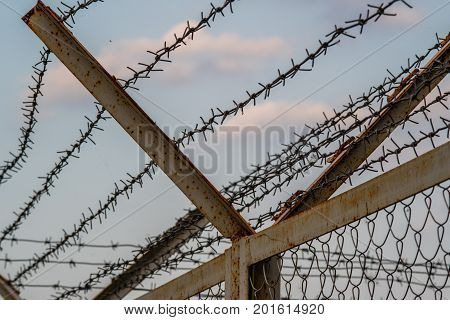 a fence with barbed wire are prohibited to enter the restricted area