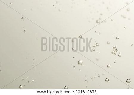 Soda fizz bubbles isolated over a blurred background