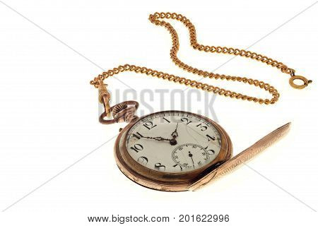 Vintage antique pocket watch with chain isolated on a white background.