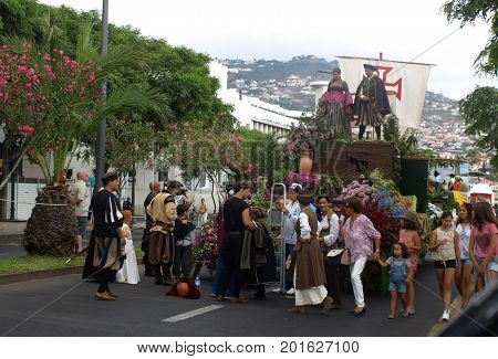 FUNCHAL; PORTUGAL - SEPTEMBER 4; 2016: Group of people in traditional costume; durnig historical and ethnographic; parade of Madeira Wine Festival in Funchal. Madeira; Portugal