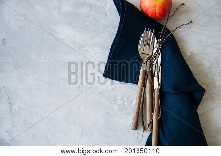 White Plate, Red Apple And Brunches On A Wooden Background. Autumn, Thanksgiving, Halloween Concept.