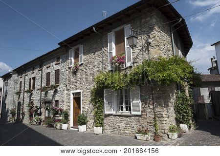 Nibbiano (Piacenza Emilia-Romagna Italy): old typical house exterior with plants and flowers