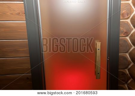 Interior of empty wooden infrared cabin in sauna