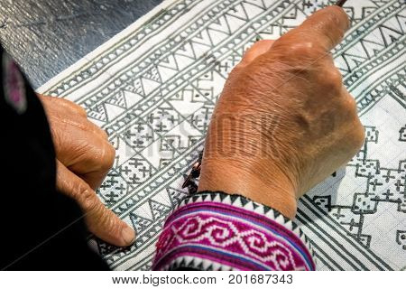 Close up Hmong hilltribe Writing candles to handmade batik in thailand