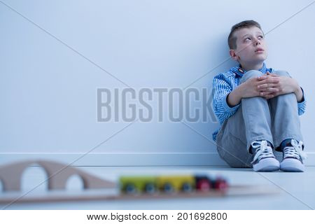 Boy Starring At Wall