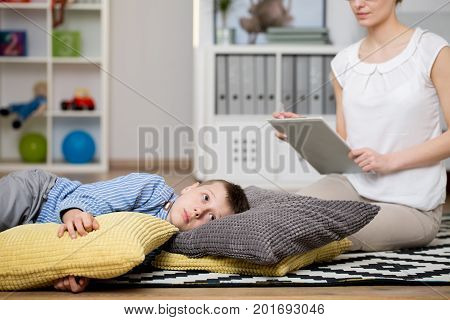 Boy Lies On Pillows