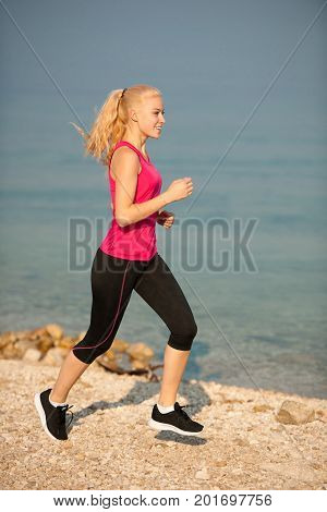 Jogging In Th Beach - Woman Runns Near Sea On Early Summer Morning