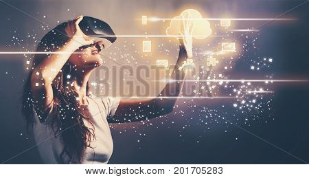 Colud Computing with young woman using a virtual reality headset