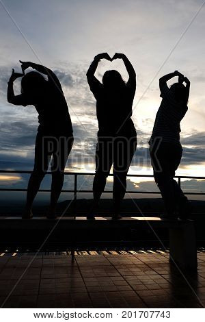 Silhouette of people Heart-shaped handmade in mountainview