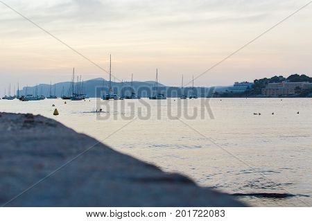 Beautiful sunset with the bay full of boats in the small town of Santa Ponca on the lively island of Mallorca. August 25, 2017. Santa Ponca, Mallorca, Spain