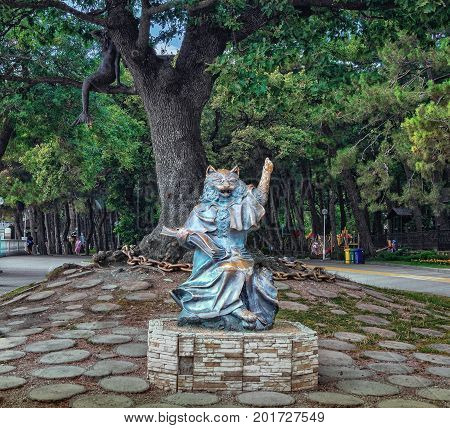 GELENDZHIK RUSSIA - JULY 21 2017: Sculpture of Cat the scientist and mermaid on the oak tree. The characters of Alexander Pushkin's fairy tales