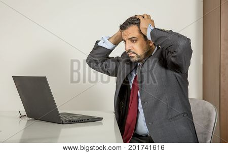 Arab Man Woking In His Laptop In The Kitchen