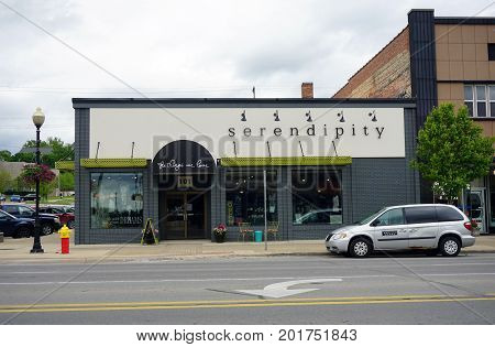 CADILLAC, MICHIGAN / UNITED STATES - MAY 31, 2017: One may purchase women's clothing and accessories at Serendipity, on Mitchell Street in Downtown Cadillac.