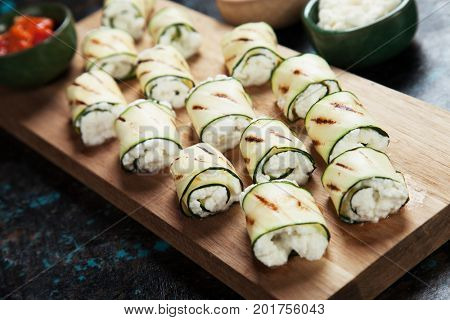 Grilled zucchini rolls filled with fresh cottage cheese