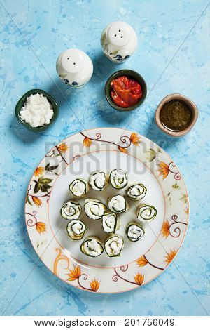 Zucchini rolls filled with fresh cottage cheese