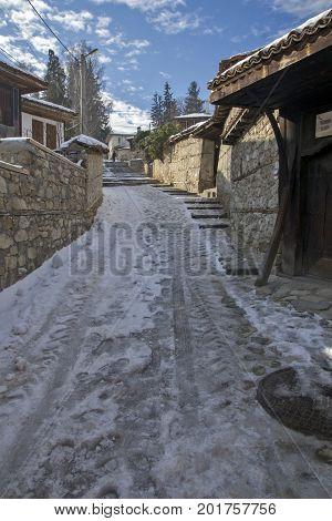 KOPRIVSHTITSA, BULGARIA - DECEMBER 13, 2013: Winter view of Street in historical town of Koprivshtitsa, Sofia Region, Bulgaria