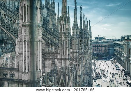 Milan Cathedral (Duomo) in Milan, Italy. Milan Duomo is the largest church in Italy and the fifth largest in the world. Piazza del Duomo in the background.