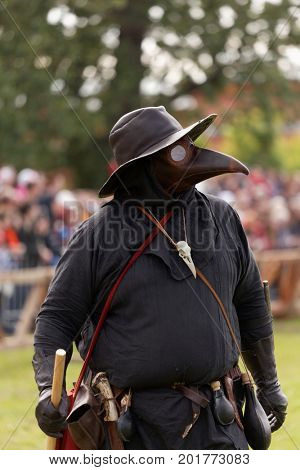 ST. PETERSBURG, RUSSIA - JULY 8, 2017: Participant in the costume of plague doctor during the military history project Battle On Neva. Main event this year is the jousting tournament
