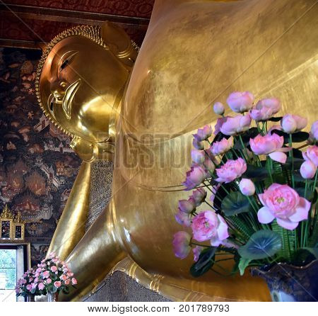 Bangkok Thailand - Aug 4 2017. Big golden Reclining Buddha in Wat Pho temple is the landmark of Bangkok Thailand and Asia. One of the oldest largest and most revered temple complexes in Bangkok.